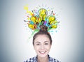 Smiling young woman with a bun, bright idea