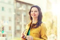 Smiling young woman in city Royalty Free Stock Photo