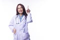 Smiling woman doctor ware uniform coat with stethoscope while use finger pointing up to something over isolated white Royalty Free Stock Photo