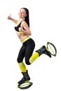 Smiling young woman doing exercises in kangoo jumps shoes Royalty Free Stock Photo