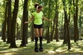 Smiling young woman doing exercises in kangoo jumps shoes Royalty Free Stock Photo