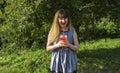 Smiling young woman drinking fresh lemonade with a straw. Concept of health and relax Royalty Free Stock Photo