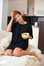 Smiling young woman eating fresh fruits Royalty Free Stock Photo