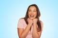 Smiling young woman expressing scare and surprise Royalty Free Stock Photo