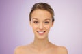 Smiling young woman face and shoulders Royalty Free Stock Photo