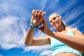 smiling young woman with fitness tracker outdoors Royalty Free Stock Photo