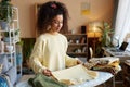 Smiling Young Woman Folding Clothes Royalty Free Stock Photo