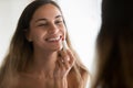 Smiling young woman get ready apply red lipstick Royalty Free Stock Photo