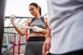 Smiling young woman getting ready for boxing outdoors Royalty Free Stock Photo