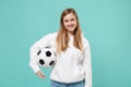 Smiling young woman girl football fan in casual white hoodie posing isolated on blue turquoise background in studio Royalty Free Stock Photo