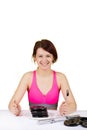 Smiling young woman girl holding a fork and a knife with dumbbells in a plate Royalty Free Stock Photo