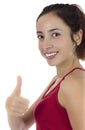 Smiling young woman giving thumbs up
