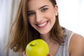 Smiling young woman with green apple Royalty Free Stock Photo