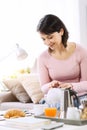 Smiling woman having breakfast Royalty Free Stock Photo