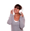 Smiling young woman with headphone listening music Royalty Free Stock Photo