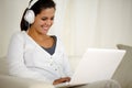 Smiling young woman with headphone listening music Royalty Free Stock Photo