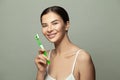 Smiling young woman with healthy teeth holding a tooth brush Royalty Free Stock Photo