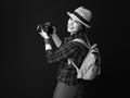 Smiling young woman hiker with modern DSLR camera taking photo Royalty Free Stock Photo