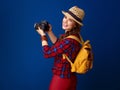 Smiling young woman hiker with modern DSLR camera taking photo Royalty Free Stock Photo