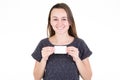 Smiling young woman holding blank white empty card in her hand with copy space for text Royalty Free Stock Photo