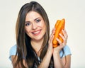 Smiling young woman holding bunch of carrot. Royalty Free Stock Photo