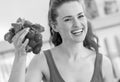 Young woman holding bunch of radishes Royalty Free Stock Photo