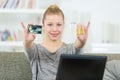 Smiling young woman holding credit cards Royalty Free Stock Photo