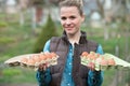Smiling young woman holding Fresh chicken eggs in hands outdoors Royalty Free Stock Photo