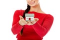 Smiling young woman holding house model Royalty Free Stock Photo