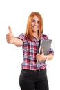 Smiling young woman holding a notebook and giving thumb up Royalty Free Stock Photo