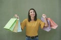 Smiling young woman holding a shopping bags