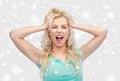 Smiling young woman holding to her head or hair Royalty Free Stock Photo