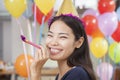 Smiling Young Woman With Horn At Office Party Royalty Free Stock Photo