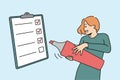 Smiling woman check box on paperwork