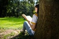 Young Woman Reading Park View from Behind Royalty Free Stock Photo