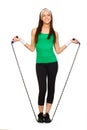 Smiling young woman with jump rope Royalty Free Stock Photo