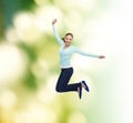 Smiling young woman jumping in air Royalty Free Stock Photo