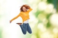 Smiling young woman jumping in air Royalty Free Stock Photo