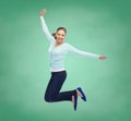 Smiling young woman jumping in air Royalty Free Stock Photo