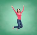 Smiling young woman jumping in air Royalty Free Stock Photo