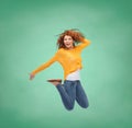 Smiling young woman jumping in air Royalty Free Stock Photo