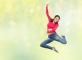 Smiling young woman jumping in air Royalty Free Stock Photo