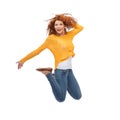 Smiling young woman jumping in air Royalty Free Stock Photo