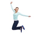 Smiling young woman jumping in air Royalty Free Stock Photo