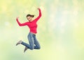 Smiling young woman jumping in air Royalty Free Stock Photo