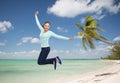 Smiling young woman jumping in air Royalty Free Stock Photo