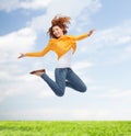 Smiling young woman jumping high in air Royalty Free Stock Photo