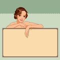 Smiling young woman leaning against a blank board Royalty Free Stock Photo