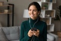 Smiling young woman listen to music in headphones Royalty Free Stock Photo