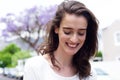Smiling young woman looking down Royalty Free Stock Photo